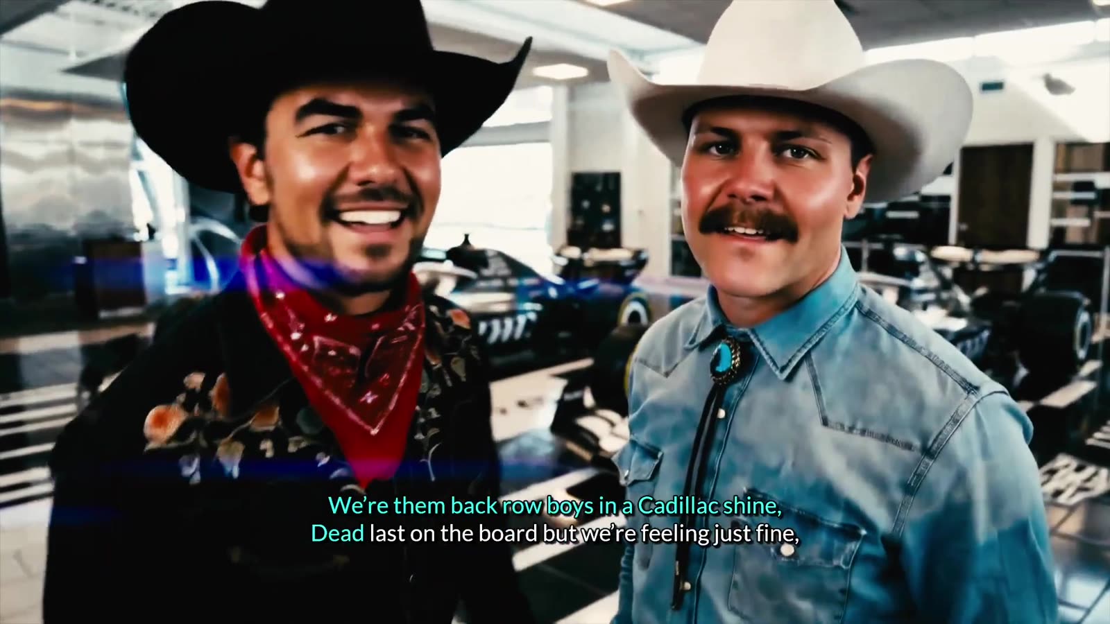 Sergio Pérez and Valtteri Bottas in cowboy hats next to the Cadillac F1 car